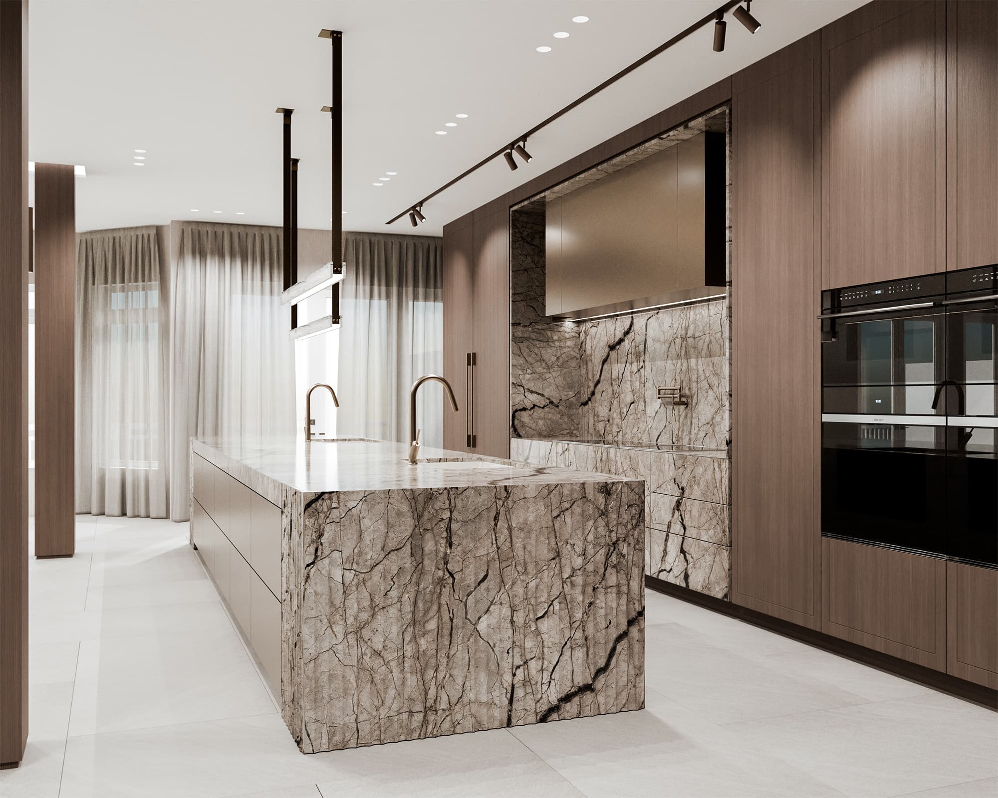 Luxury modern kitchen design featuring a large waterfall island wrapped in heavily veined grey marble with integrated dual sinks and gold faucets.