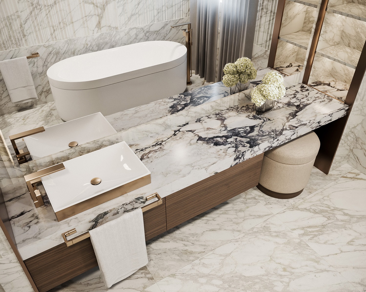 High-angle view of a luxury primary bathroom design emphasizing premium stone and tile integration. Features a double vanity with a heavily veined Calacatta marble countertop, dual white rectangular vessel sinks with brushed gold fixtures, a floating walnut cabinet, and an oval freestanding soaking tub in the background.