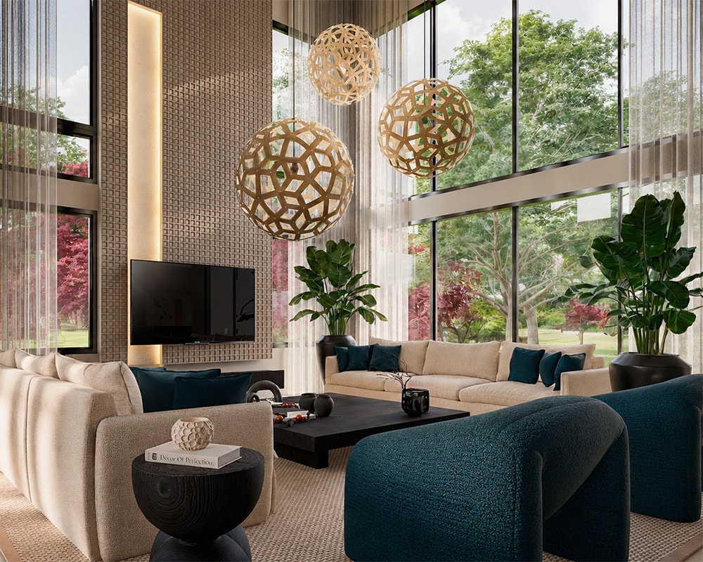 Interior view of a luxury double-height living room featuring an open-concept layout with floor-to-ceiling glass walls looking out onto a landscaped garden. The modern space showcases a massive textured accent wall with a mounted television, a large neutral sectional sofa accented with deep teal pillows, lush indoor plants, and three large, sculptural spherical pendant lights suspended from the high ceiling.
